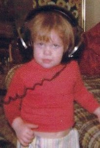 Young DJ Natural Nate® as a child with headphones on